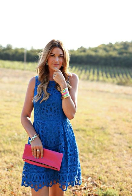 cobalt blue lace dress and red clutch